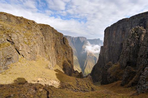 Mountain Pass with sharp peak and low lying cloud in background, Mweni, Drakensberg, Kwazulu Natal, South Africa