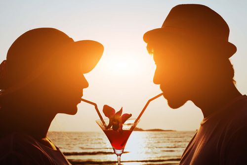 beach-drink-couple-shutterstock_247281169