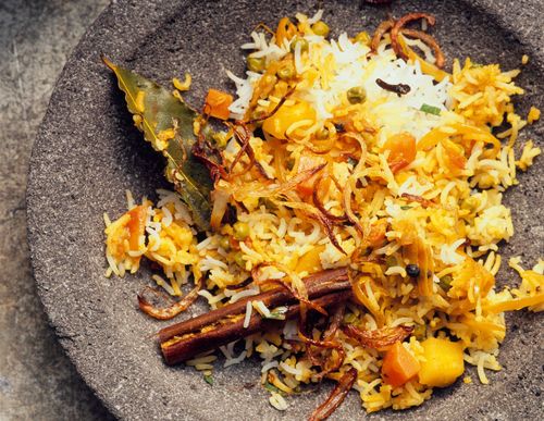 Subzi biryani, vegetable biryani with carrots, potatoes, fried onions, cinnamon, bay leaf