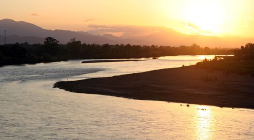 The sun sets over a small river running from Olancho to the Caribbean on Honduras' North Coast between La Ceiba and Trujillo.. Image shot 2007. Exact date unknown.